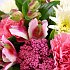 A close-up view of the Garden Bouquet - Containing: sweet scented stock, together with delicate alstroemeria and pretty pink roses.