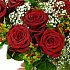 The elegant arrangement of 12 first grade red roses with gypsophila.