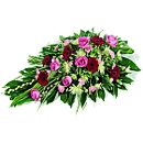 Red and Pink - A Single ended Casket Spray comprising of red roses, pink carnations, hot pink germini, delianne and seasonal flowers.