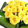 Twenty stems of Friendship - yellow roses and lush green aspidistra leaves, bringing warm sunny feelings of happiness!