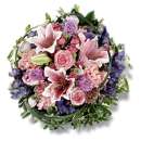 Loose Posy in Seasonal Pink - A pretty pink posy comprising seasonal pink lilies and roses mixed with lilac freesia.