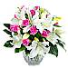Rose and Lily; An elegant collection of lustrous pink roses intermingled with crisp fresh white lilies, embraced with lush green foliage. Rose and Lily; An elegant collection of lustrous pink roses intermingled with crisp fresh white lilies, embraced with lush green foliage.