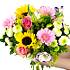 The Sunburst bouquet, including roses, germini and lilies amongst many other summery flowers.